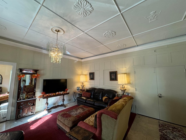 living room featuring a notable chandelier and crown molding