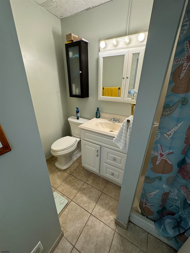 bathroom featuring vanity, tile patterned floors, toilet, and a shower with curtain