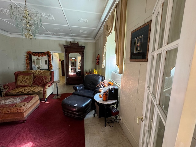 living area featuring cooling unit and a notable chandelier