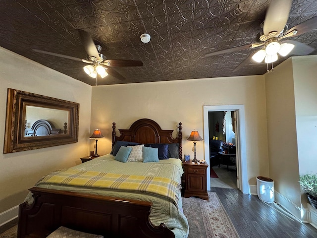 bedroom with dark wood-type flooring and ceiling fan