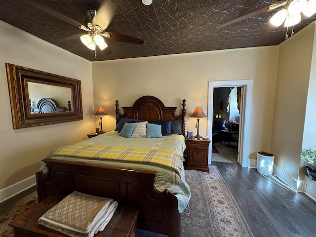 bedroom with ceiling fan and dark hardwood / wood-style floors