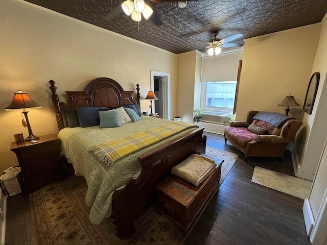 bedroom featuring ceiling fan and dark hardwood / wood-style flooring