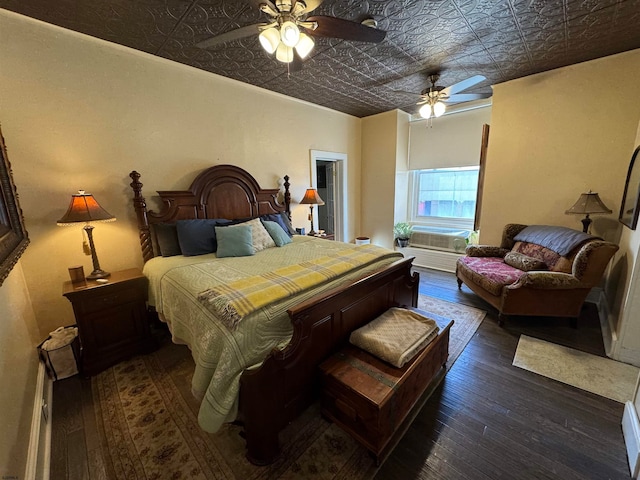 bedroom with ceiling fan and dark hardwood / wood-style floors