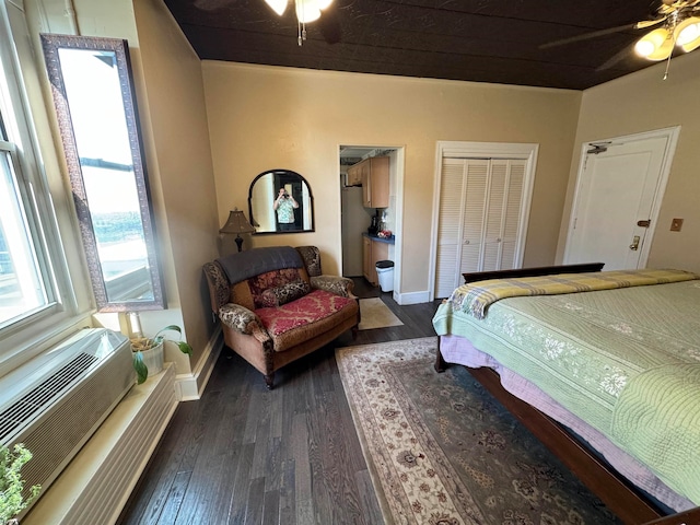 bedroom featuring ceiling fan and dark hardwood / wood-style floors