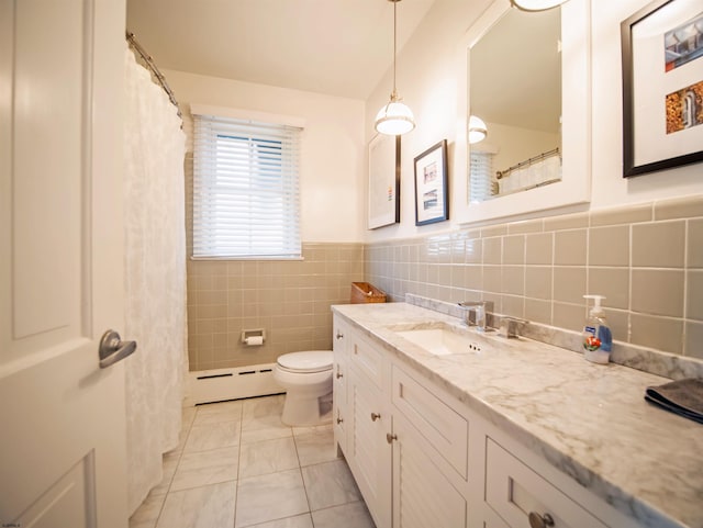 bathroom with a baseboard radiator, toilet, tile walls, tile patterned flooring, and vanity