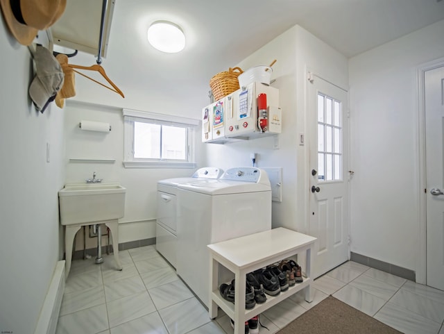 clothes washing area featuring independent washer and dryer