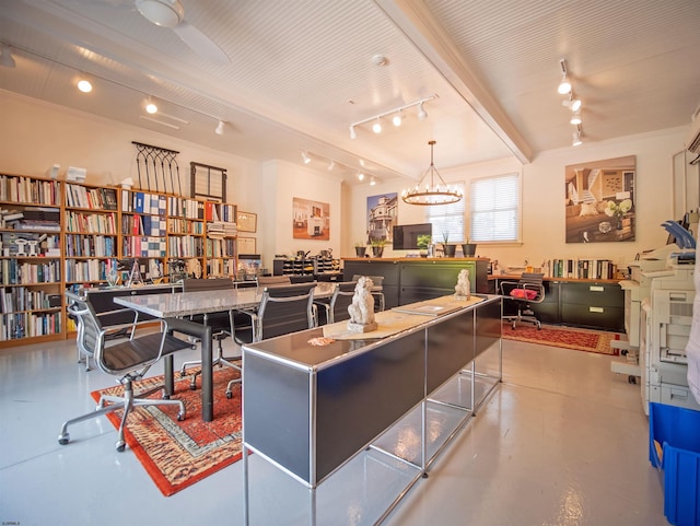 interior space with crown molding, pendant lighting, a breakfast bar, a chandelier, and a center island