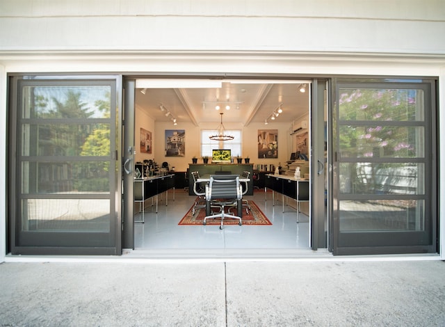 entrance to property featuring a wall unit AC