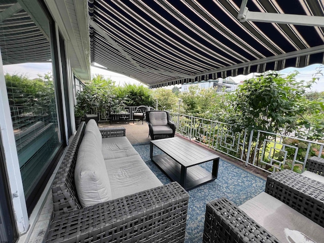 view of patio with a balcony and an outdoor hangout area