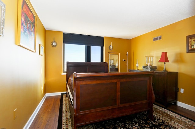 bedroom featuring wood-type flooring