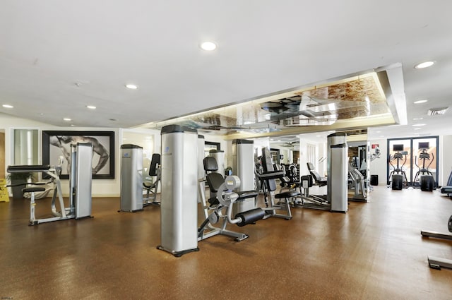 workout area with a raised ceiling