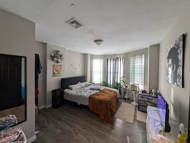 bedroom featuring dark wood-type flooring