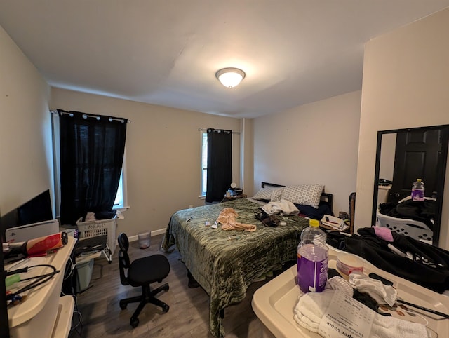 bedroom featuring hardwood / wood-style flooring