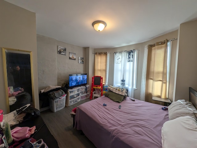 bedroom featuring dark wood-type flooring