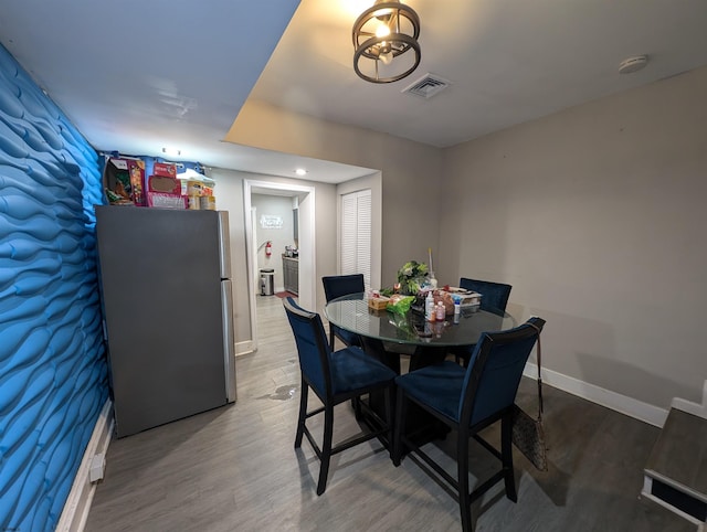 dining room featuring hardwood / wood-style flooring