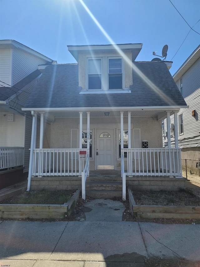 view of front of home featuring covered porch