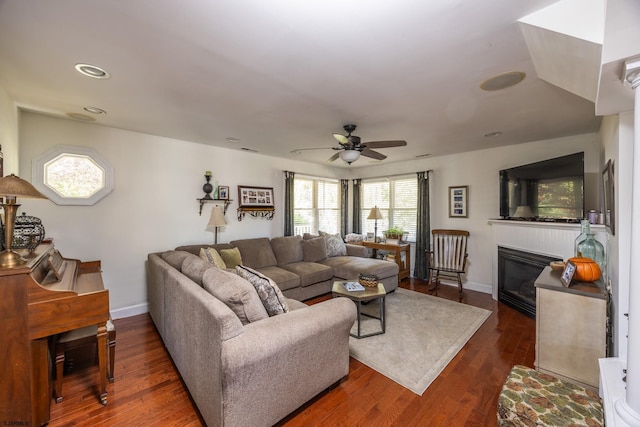 living room with dark hardwood / wood-style floors and ceiling fan