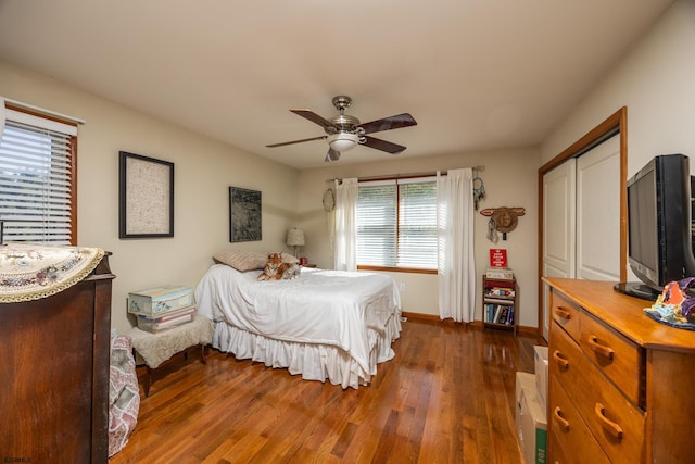 bedroom featuring a closet, ceiling fan, and dark hardwood / wood-style floors