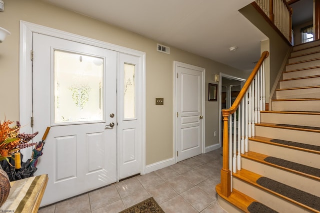 foyer with light tile patterned floors