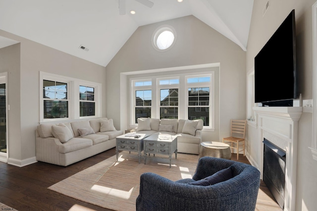 living room featuring high vaulted ceiling, hardwood / wood-style flooring, and ceiling fan