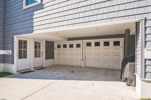 garage featuring a carport