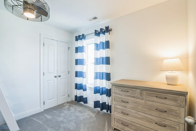 carpeted bedroom featuring a closet