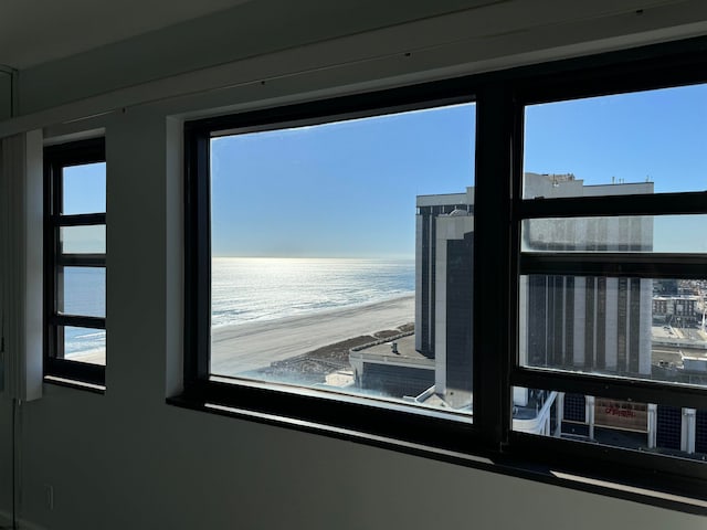 room details with a view of the beach and a water view