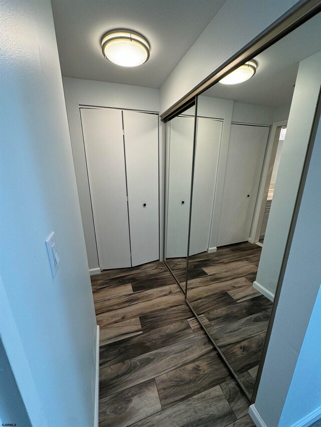 hallway featuring dark hardwood / wood-style floors