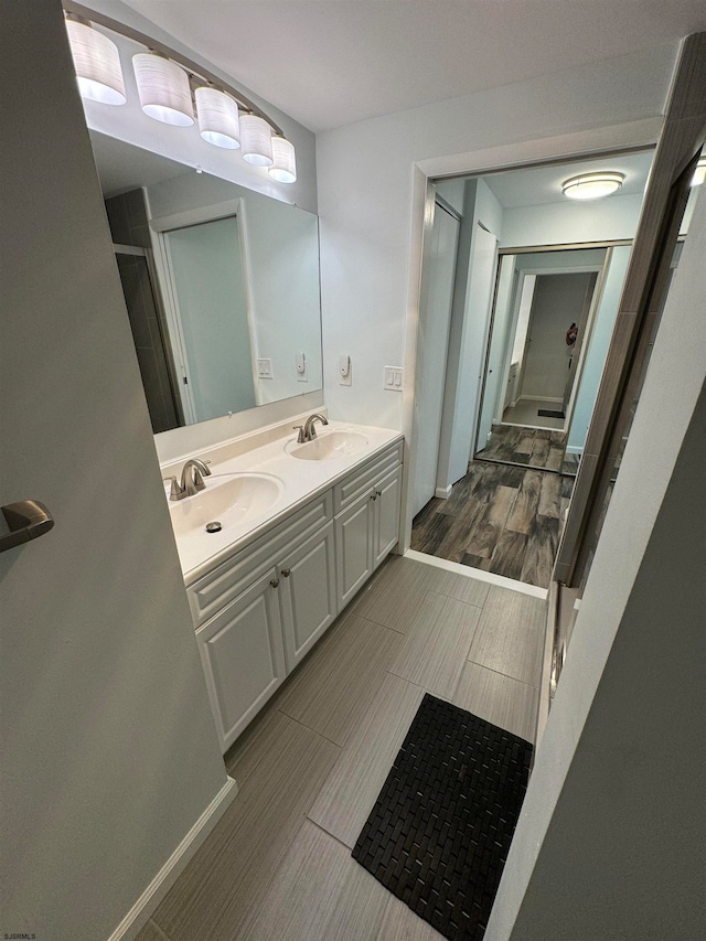 bathroom featuring hardwood / wood-style flooring and vanity