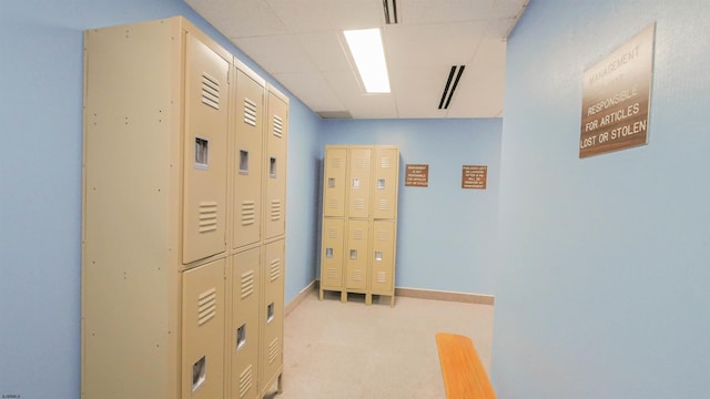 hallway featuring light colored carpet