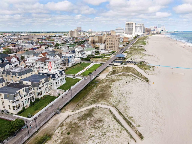 aerial view with a beach view and a water view