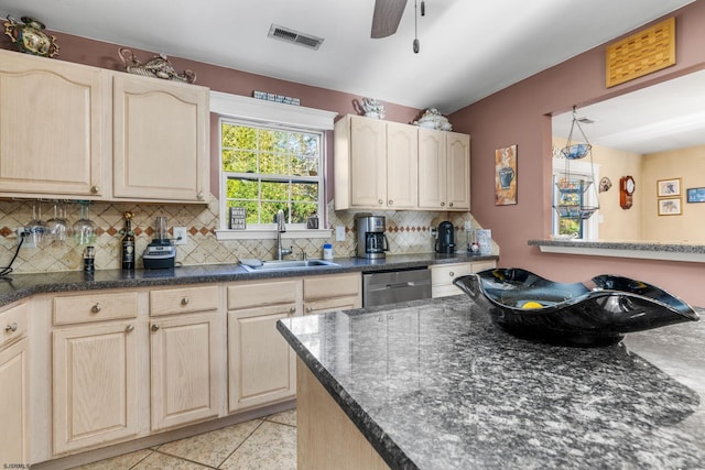 kitchen featuring light tile patterned flooring, sink, ceiling fan, backsplash, and dishwasher