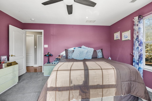 bedroom with ceiling fan and carpet flooring