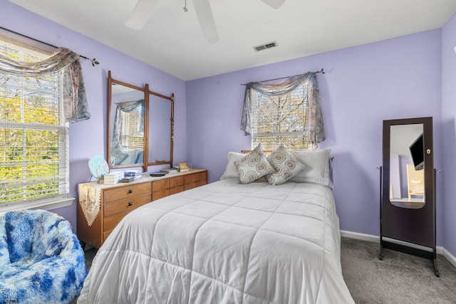 carpeted bedroom featuring ceiling fan