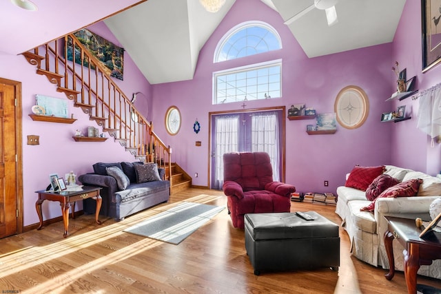 living room featuring hardwood / wood-style flooring and high vaulted ceiling