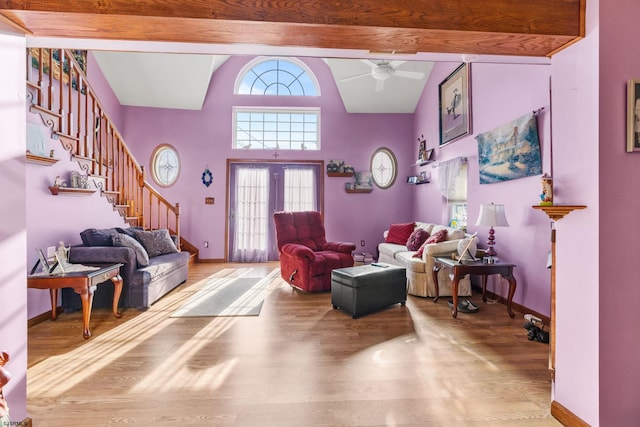 entryway with vaulted ceiling with beams, wood-type flooring, and ceiling fan