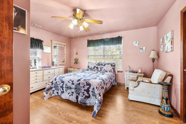 bedroom featuring ceiling fan and light hardwood / wood-style flooring