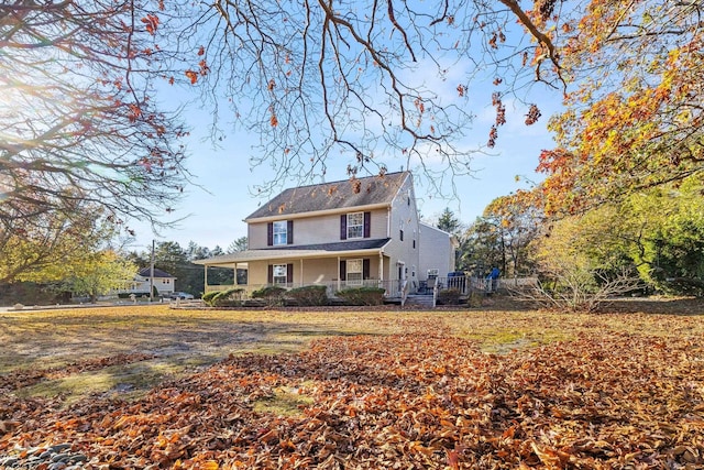 rear view of house with a porch