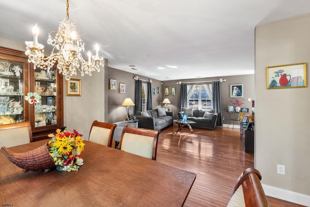 dining room featuring an inviting chandelier and hardwood / wood-style floors