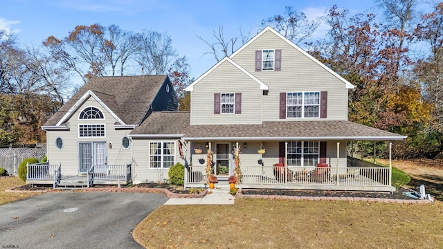 view of front of home featuring a porch and a front lawn