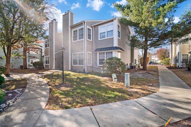 view of home's exterior with a yard