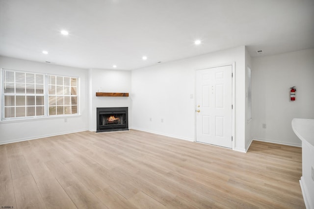 unfurnished living room featuring light hardwood / wood-style floors