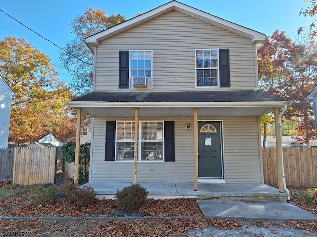 view of front property featuring covered porch and cooling unit