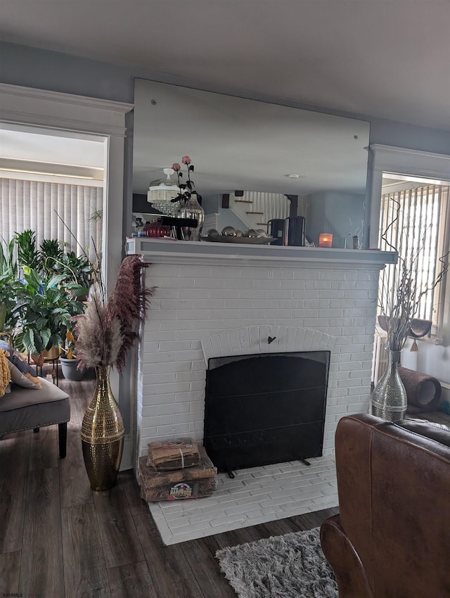 room details featuring hardwood / wood-style floors and a brick fireplace