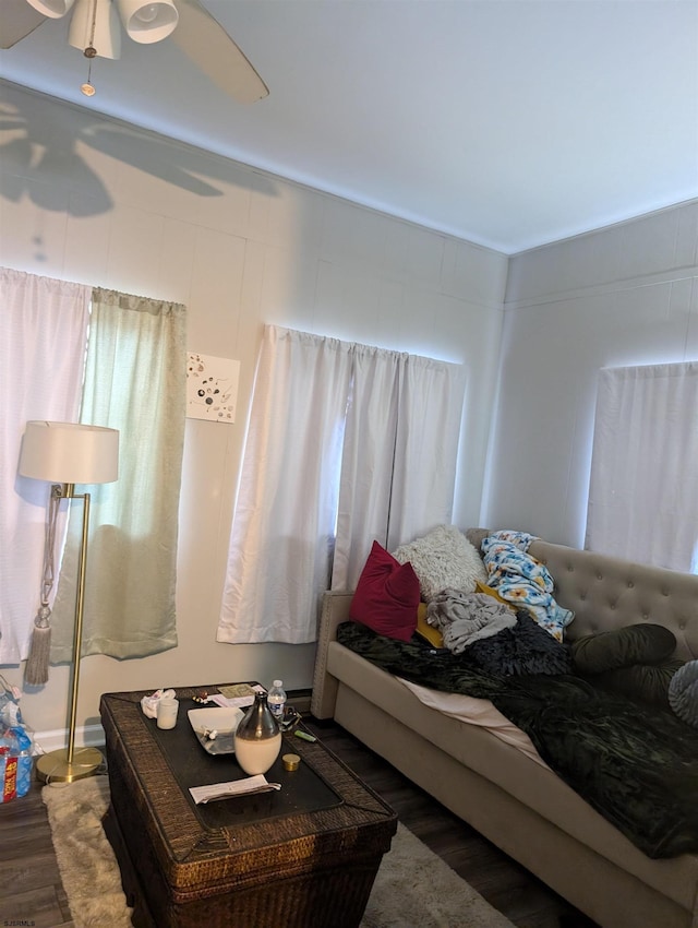 bedroom featuring ceiling fan and dark wood-type flooring