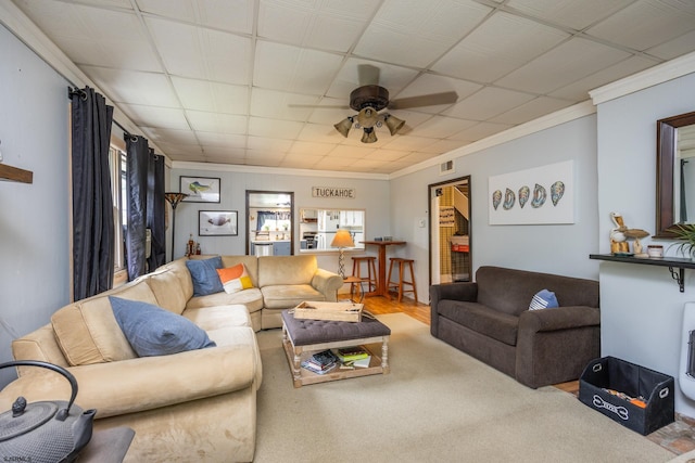 living room featuring ornamental molding, a wealth of natural light, and ceiling fan