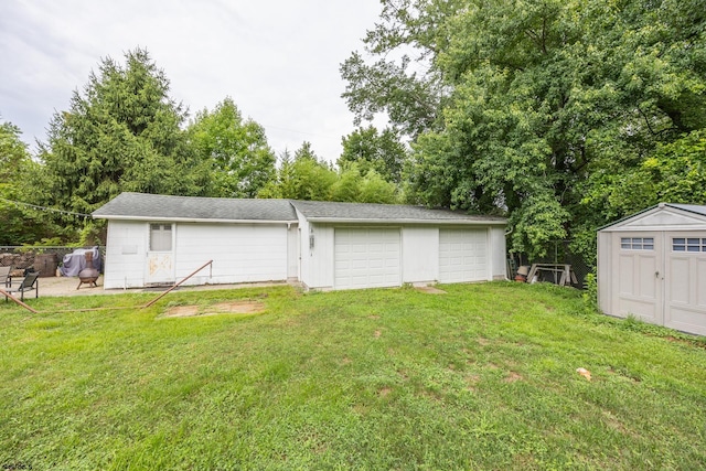 garage featuring a yard