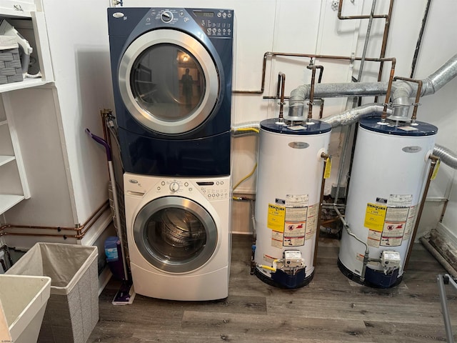 laundry room with dark hardwood / wood-style flooring, stacked washer / dryer, and water heater