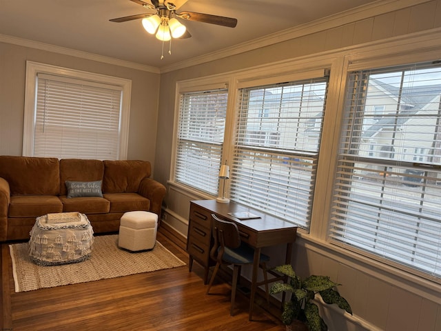 living room featuring dark hardwood / wood-style floors, ceiling fan, and crown molding