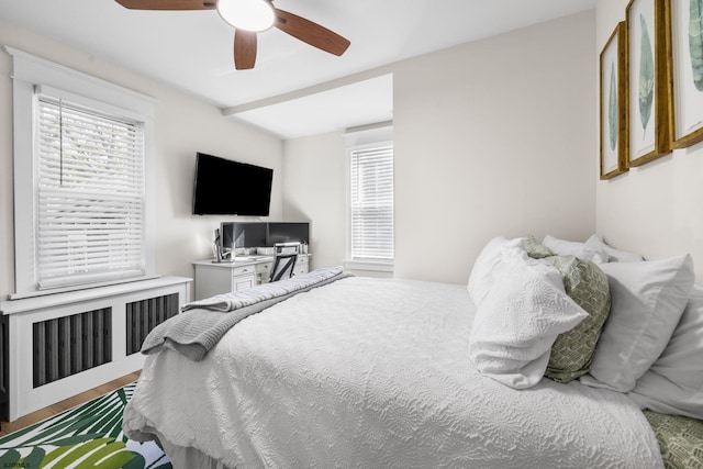 bedroom featuring hardwood / wood-style floors and ceiling fan